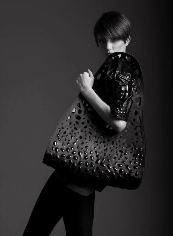 Leather accessories, black leather bag with three-dimensional embossing and cut-outs. SHAROKINA Modification