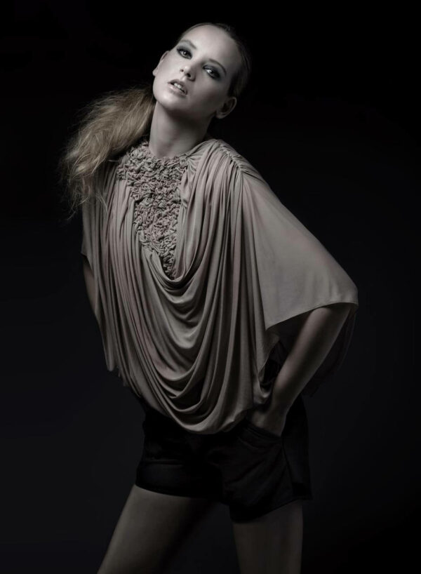 Draped skin-tone chiffon top with partial fabric manipulation and leather hot pants. SHAROKINA Polymorph