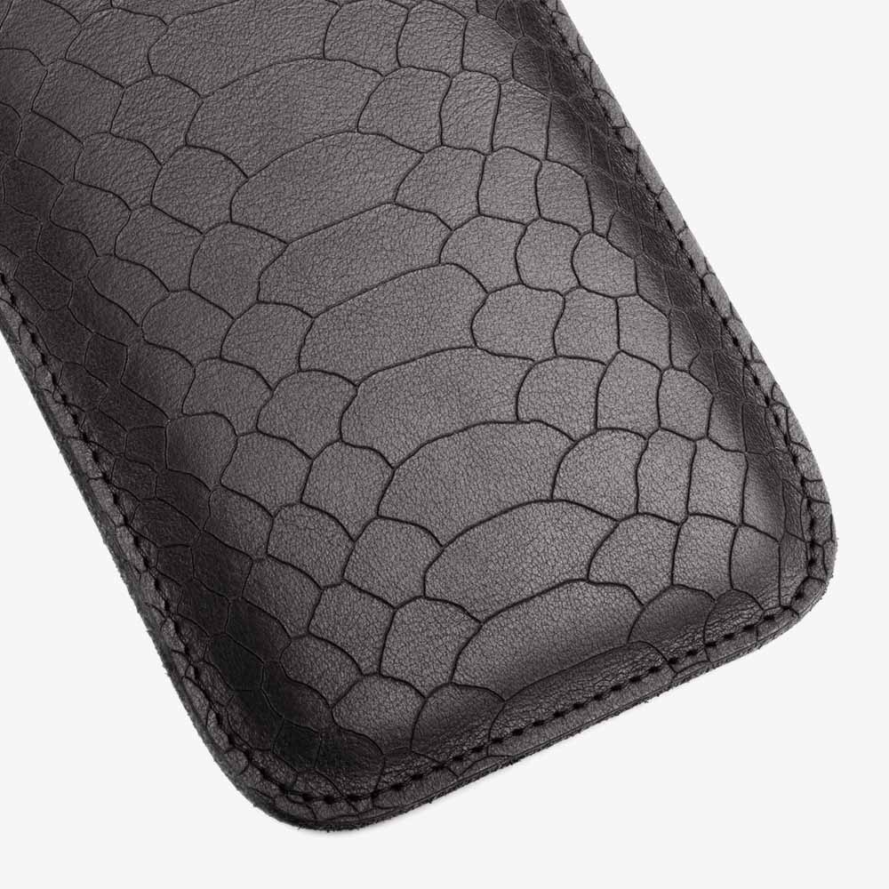 Leather cell phone case in black, snake-look laser engraving. SHAROKINA Cava Snake